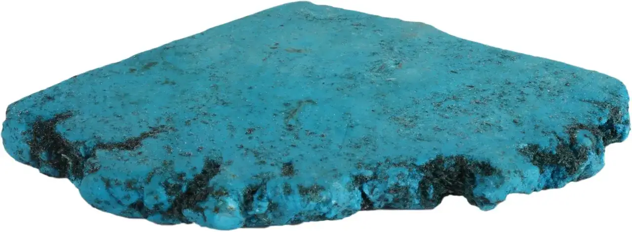 Niebieski, nierówny krysztal turkusowy z ciemnymi wtrąceniami, przypominający fragment starożytnego artefaktu.